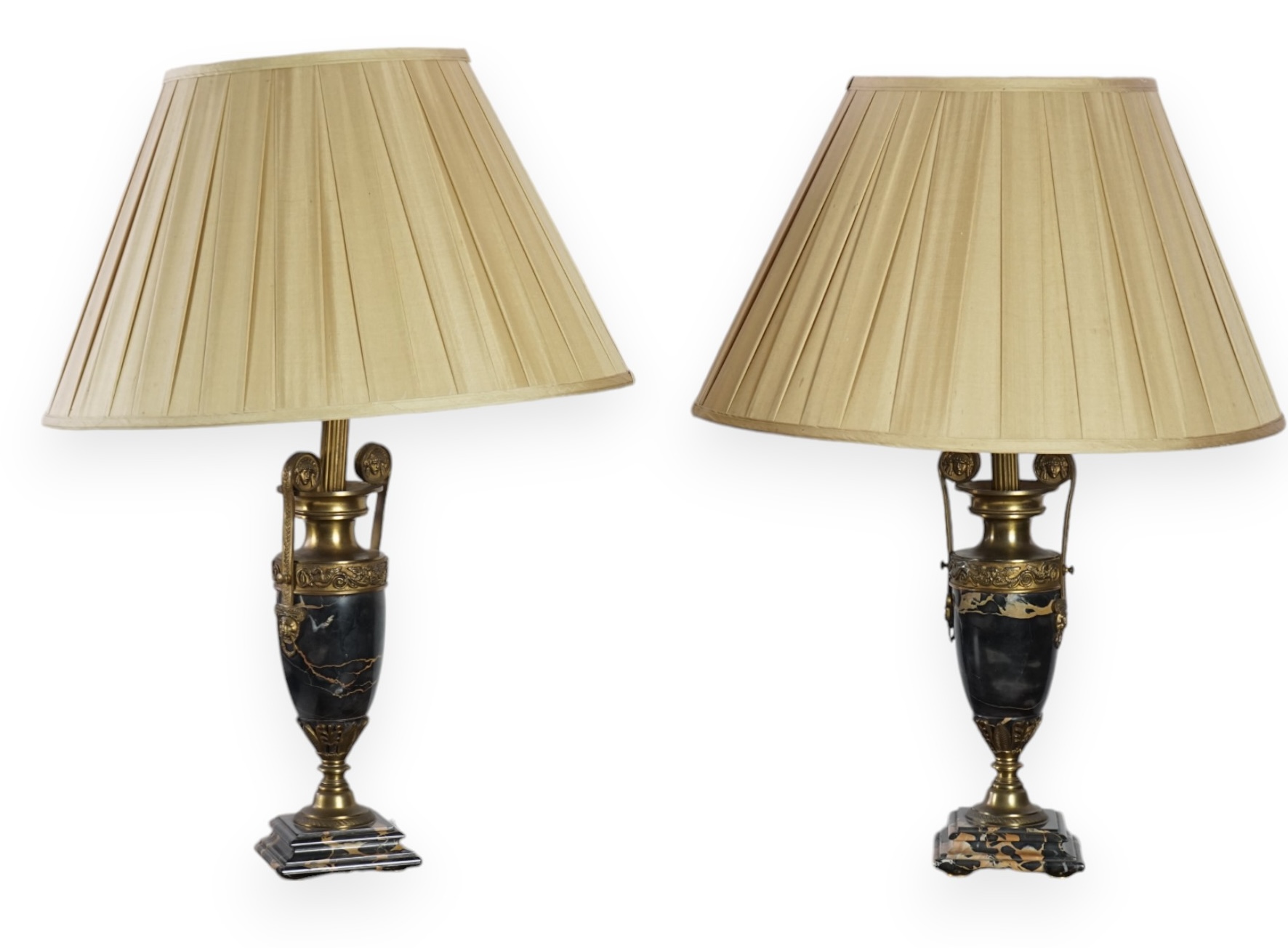 A pair of French Empire style ormolu mounted black marble table lamps